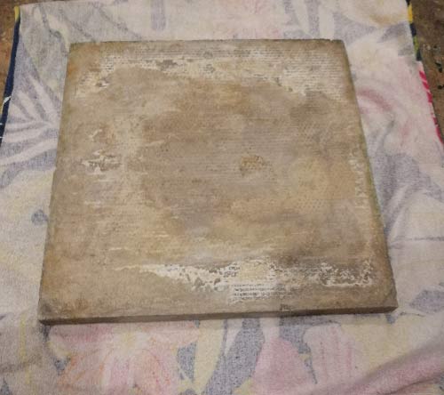 Slab positioned on solid cutting surface