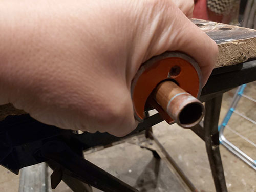 Cutting copper pipe using a pipe cutter