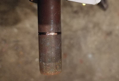 Score in copper pipe to guide hacksaw blade