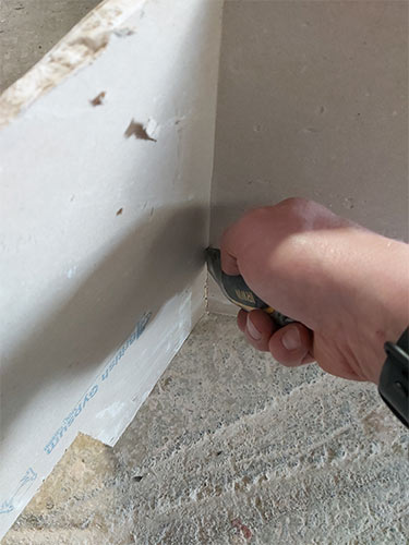 Cut along backing paper with utility knife
