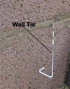 Wall Tie Positioned Between Mortar Joints in Internal Cavity Wall