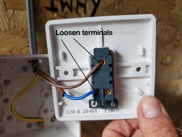 Loosen wires in rear of switch faceplate