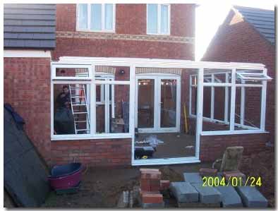 All upvc conservatory modules fixed in place including door module