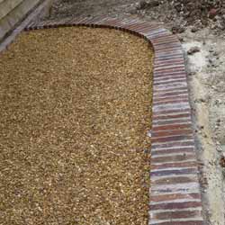 Brick edging to gravel driveway