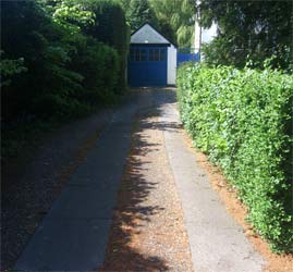 Track driveway leading to garage