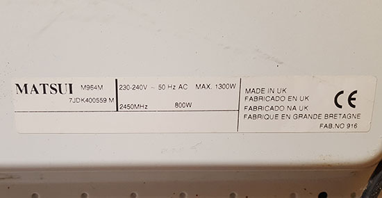 Power rating label on rear of microwave