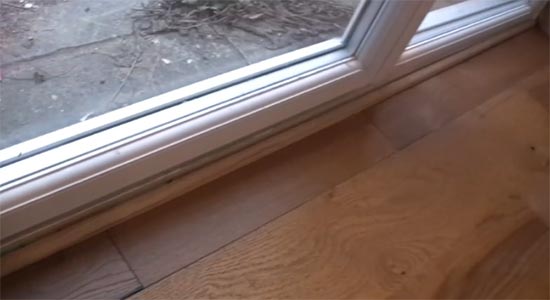 Timber quadrant across door threshold