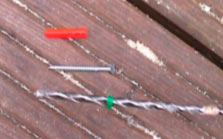 Masonry drill bit, wall plug and nail to mark the hole