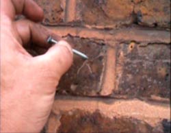 Mark the wall with a nail where you want to drill