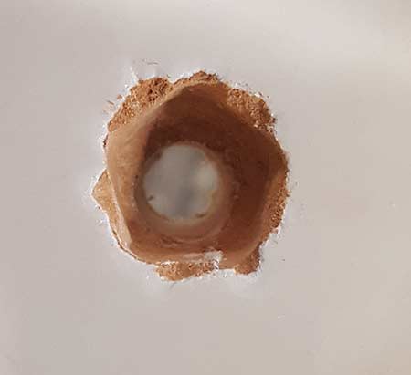 Pilot hole drilled for metal plasterboard fixing
