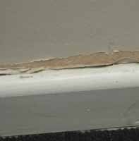 Skirting gap with flaky paint ideal for caulk filling