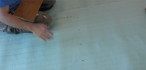 Mark laminate board widths on floor