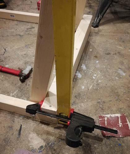 Straight edge clamped to back of frame