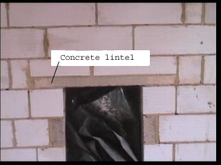 Concrete lintel in place above doorway