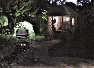 The cave, waterfalls and summer house lit up at night