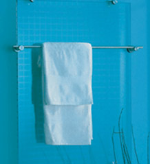 Glass radiator covered by towel rail