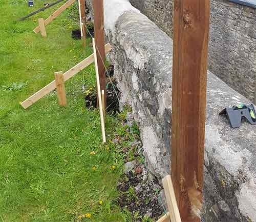 Fence posts installed ready for gravel boards