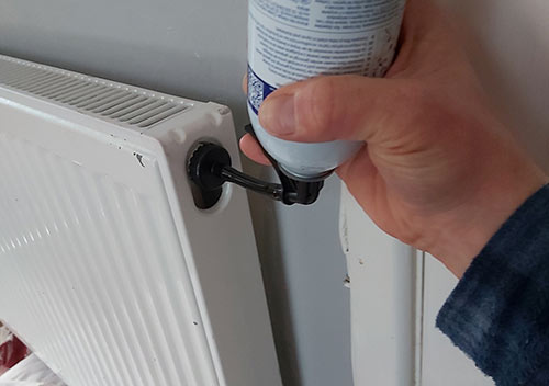 Adding central heating inhibitor to a radiator