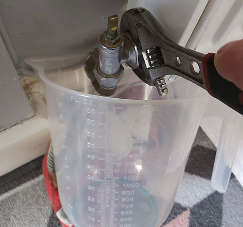 Water drained out of radiator for inhibitor to be added