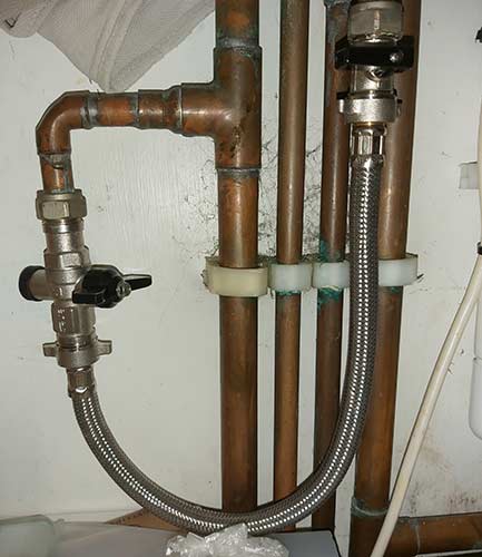 Filling loop for inhibitor addin to sealed central heating system