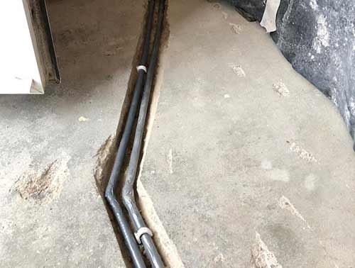 Section of central heating pipe repaired in floor