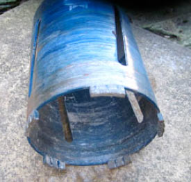 A masonry hole saw with diamond tipped teeth