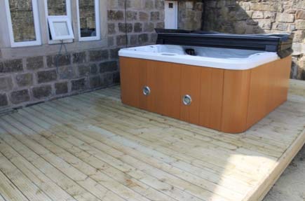 A hot tub positioned on decking