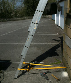 Ladder safely secured to wall