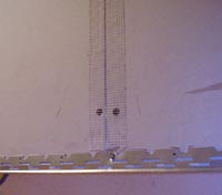 Bead and scrim tape applied to joints and corners of the lighting box