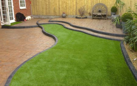 Laying artificial grass on hard surface