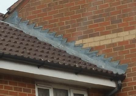 Stepped flashing where gable end abuts next door roof
