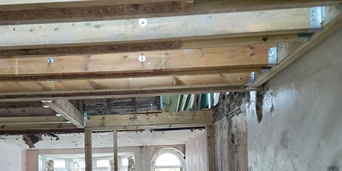 New ceiling joists fixed using joist hangers