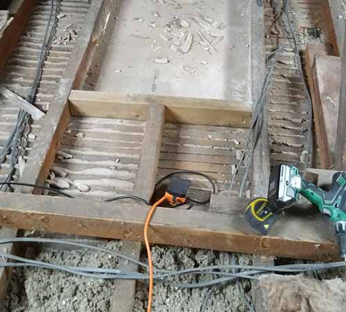 Electrical cables laying over the top of existing ceiling joists