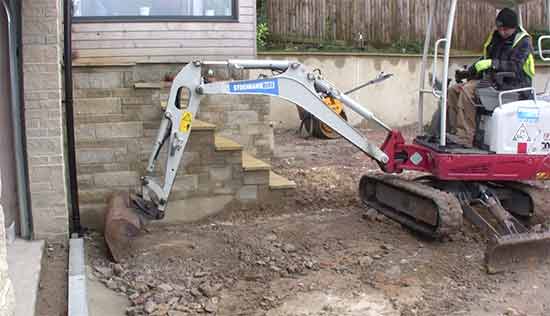 Clearing existing drive surface with mini digger