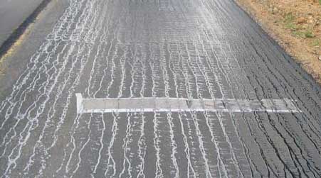 Tack coat applied to existing surface