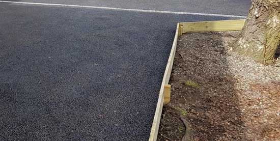 Timber edging around driveway