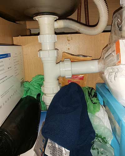 Clear space under sink for area to work