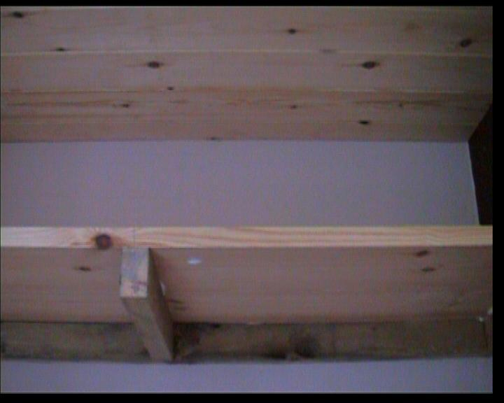 Close up of Shelving showing supporting strut added to centre