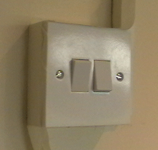 Masking a light switch before painting