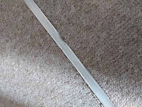 Carpet running between 2 rooms with pile running the same way