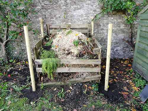 All 4 fence posts installed for compost bin