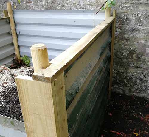 Side timbers fixed on to compost bin