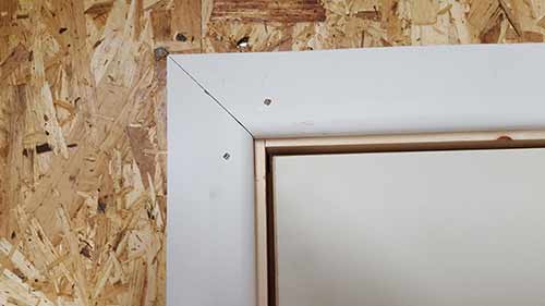 Architrave installed around door frame