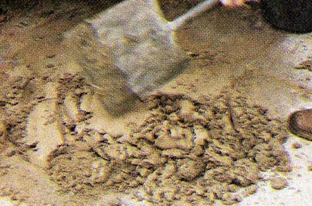 Turn the sand and mortar mix over on itself to mix thourghly