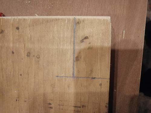 Marking a notch on the divider to fit over the framework