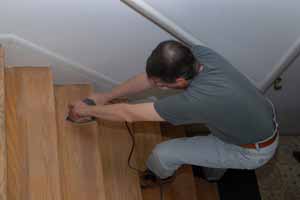 Sanding and cleaning stairs
