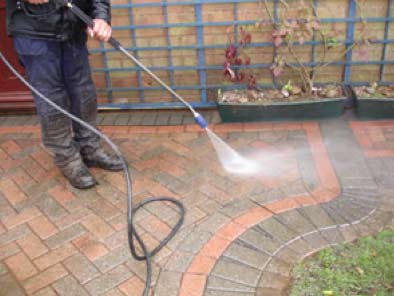 Cleaning with a pressure washer