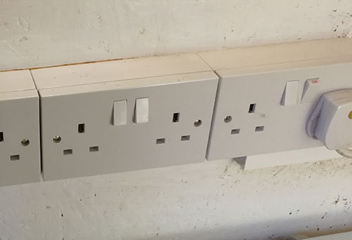 Deep plastic back box sticking out form wall causing a hazard