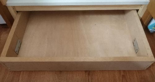 Plinth drawer with castor wheels