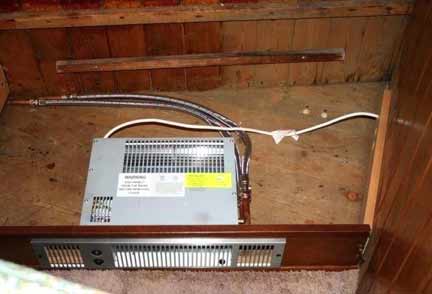 A plinth heater in place in kickboard